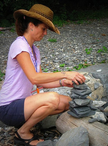 Teacher piling stones